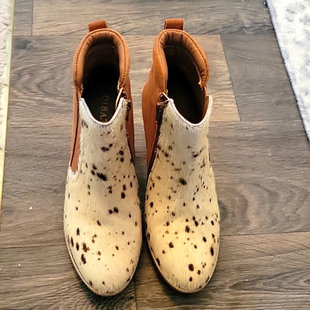 They are ankle boots suede and cow hide and never been worn. They are size 7